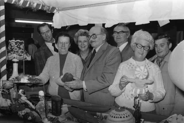 Conservative Association members examining items on sale are (from the left): County Coun. J. Wyld, Miss D. Roylance (treasurer), Coun. Mrs E. Tate, Coun. L. Bullock (chairman), Coun. M. Tate and Coun. Mrs I. Sutcliffe.