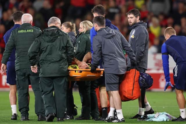 NOTTINGHAM, ENGLAND - AUGUST 30: Hjalmar Ekdal of Burnley is stretchered off by medical staff having picked up an injury during the Carabao Cup Second Round match between Nottingham Forest and Burnley at City Ground on August 30, 2023 in Nottingham, England. (Photo by Nathan Stirk/Getty Images)