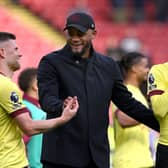 SHEFFIELD, ENGLAND - APRIL 20: Burnley manager Vincent Kompany congratulates Johann Berg Gudmundsson after the Premier League match between Sheffield United and Burnley FC at Bramall Lane on April 20, 2024 in Sheffield, England. (Photo by Stu Forster/Getty Images)