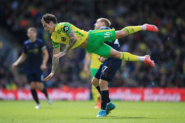 NORWICH, ENGLAND - APRIL 10: Mathias Normann of Norwich City collides with Matej Vydra of Burnley during the Premier League match between Norwich City and Burnley at Carrow Road on April 10, 2022 in Norwich, England. (Photo by Stephen Pond/Getty Images)