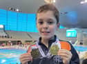 Ethan Jennings with the gold medals he won at two national swimming competitions representing his school, Park Hill St Joseph's in Burnley