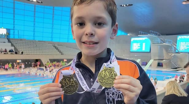 Ethan Jennings with the gold medals he won at two national swimming competitions representing his school, Park Hill St Joseph's in Burnley