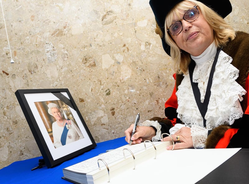 The Mayor of Wyre Councillor Julie Robinson signs the book of condelence for The Queen at Wyre Civic Centre. Photo: Kelvin Stuttard