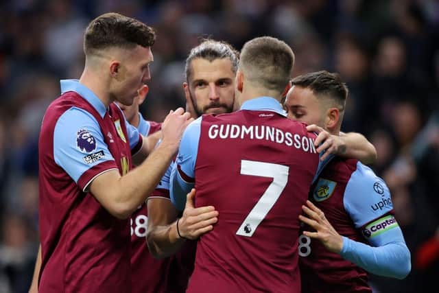 BURNLEY, ENGLAND - NOVEMBER 25: Jay Rodriguez of Burnley celebrates with teammates after scoring the team's first goal from a penalty kick during the Premier League match between Burnley FC and West Ham United at Turf Moor on November 25, 2023 in Burnley, England. (Photo by James Gill/Getty Images)