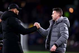 BURNLEY, ENGLAND - JANUARY 12: Vincent Kompany, Manager of Burnley, (L) and Rob Edwards, Manager of Luton Town, (R) shake hands prior to kick-off ahead ofthe Premier League match between Burnley FC and Luton Town at Turf Moor on January 12, 2024 in Burnley, England. (Photo by Naomi Baker/Getty Images)