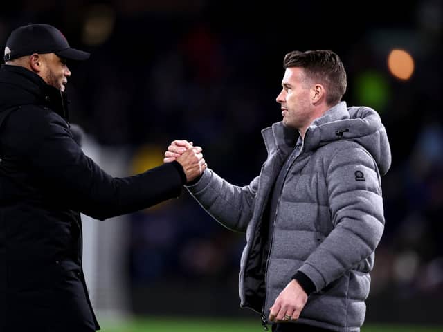 BURNLEY, ENGLAND - JANUARY 12: Vincent Kompany, Manager of Burnley, (L) and Rob Edwards, Manager of Luton Town, (R) shake hands prior to kick-off ahead ofthe Premier League match between Burnley FC and Luton Town at Turf Moor on January 12, 2024 in Burnley, England. (Photo by Naomi Baker/Getty Images)