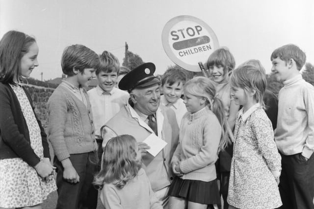 A group of Burnley schoolchildren said goodbye to their favourite lollipop man, 73-year-old Mr Percy Whitehead, and presented him with a £5 gift voucher they collected themselves. Mr Whitehead showed children of Lowerhouse Junior School across the busy road for the last time on Friday, 24th September 1971.