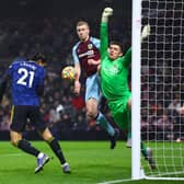 BURNLEY, ENGLAND - FEBRUARY 08: Edinson Cavani of Manchester United attempts a header which was saved by Nick Pope of Burnley during the Premier League match between Burnley and Manchester United at Turf Moor on February 08, 2022 in Burnley, England. (Photo by Clive Brunskill/Getty Images)