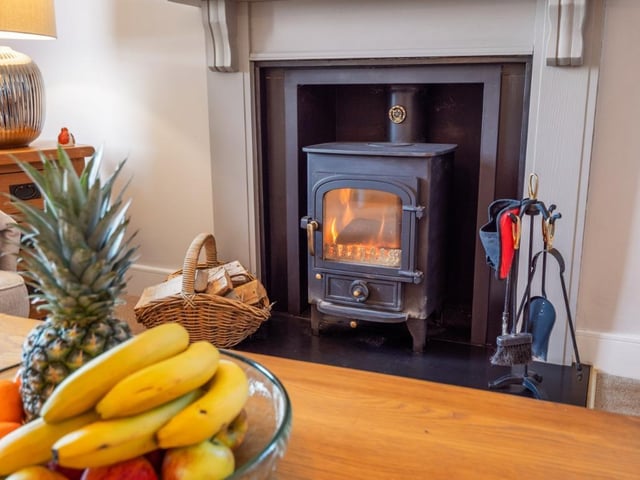 Wood burning stove in sitting room.