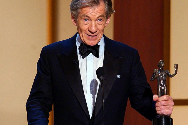 Sir Ian McKellen accepts his award for Outstanding Performance by a Male Actor in a Supporting Role-Motion Picture for his role in "Lord of the Rings: The Fellowship of the Ring," at the 8th Annual Screen Actors Guild Awards in Los Angeles, CA, 10 March 2002.  Photo by LUCY NICHOLSON/AFP via Getty Images