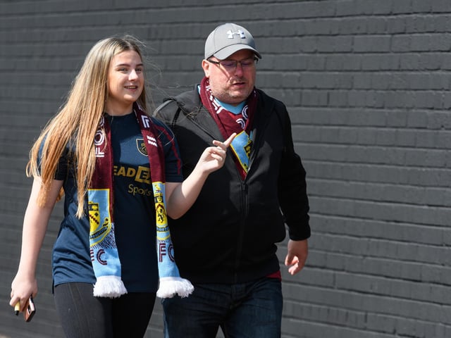 Burnley fans arrive at Turf Moor ahead of the Lancashire Derby with Blackpool. Photo: Kelvin Stuttard