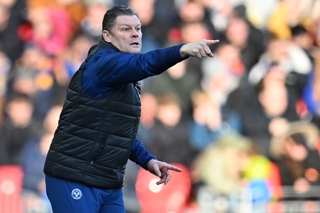 Shrewsbury Town's English manager Steve Cotterill shouts instructions to his players from the touchline during the English FA Cup third round football match between Liverpool and Shrewsbury Town at Anfield in Liverpool, north west England on January 9, 2022.