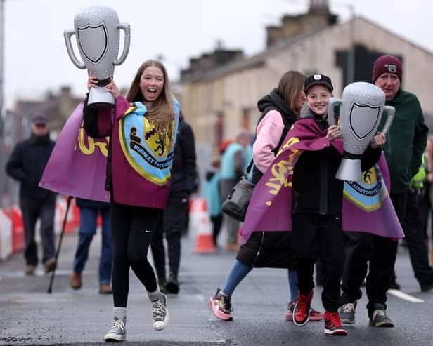 BURNLEY, ENGLAND - APRIL 22: Supporters of Burnley arrive at Turf Moor prior to the Sky Bet Championship between Burnley and Queens Park Rangers at Turf Moor on April 22, 2023 in Burnley, England. (Photo by Alex Livesey/Getty Images)