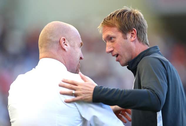 Graham Potter, Manager of Brighton and Hove Albion greets Sean Dyche, Manager of Burnley. (Photo by Dan Istitene/Getty Images)