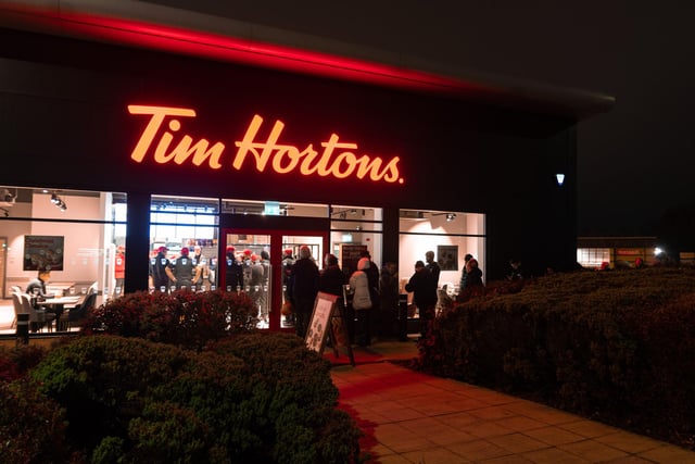 Customers queue outside Tim Hortons in Burnley before its official opening at 7am. Photo: Kelvin Stuttard