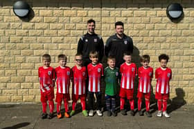 Lewis Tillotson and Nik Hothersall with one of Colne FC Juniors' under six teams.