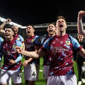 BLACKBURN, ENGLAND - APRIL 25: Johann Gudmundsson of Burnley celebrates alongside teammates towards the fans after winning the Sky Bet Championship following victory against the Blackburn Rovers and Burnley at Ewood Park on April 25, 2023 in Blackburn, England. (Photo by Matt McNulty/Getty Images)