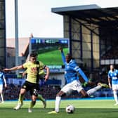 LIVERPOOL, ENGLAND - APRIL 06: Abdoulaye Doucoure of Everton crosses the ball under pressure from Josh Cullen of Burnley during the Premier League match between Everton FC and Burnley FC at Goodison Park on April 06, 2024 in Liverpool, England. (Photo by Matt McNulty/Getty Images)