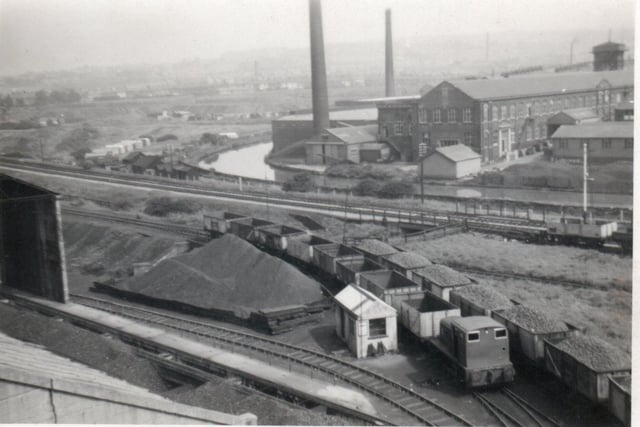 The canal at Elm Street in 1958. Cameron and Livingstone Mills can be seen, right, with railway waggons, carrying coal to Burnley gas works, in the foreground.