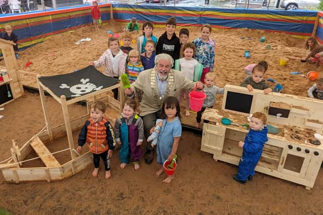 Barnoldswick Town Council chairman Coun. Chris Church joins local youngsters to launch Barlick Beach 2023