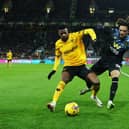 WOLVERHAMPTON, ENGLAND - DECEMBER 05: Nelson Semedo of Wolverhampton Wanderers is challenged by Luca Koleosho of Burnley during the Premier League match between Wolverhampton Wanderers and Burnley FC at Molineux on December 05, 2023 in Wolverhampton, England. (Photo by David Rogers/Getty Images)