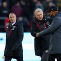 BURNLEY, ENGLAND - NOVEMBER 25: David Moyes, Manager of West Ham United, and Vincent Kompany, Manager of Burnley, interact prior to the Premier League match between Burnley FC and West Ham United at Turf Moor on November 25, 2023 in Burnley, England. (Photo by James Gill/Getty Images)