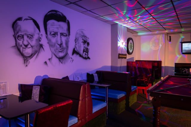 The Secrets bar lounge with the mural of three Burnley FC legends Bob Lord, Jimmy McIlroy and Sean Dyche, and claret and blue-themed booths.