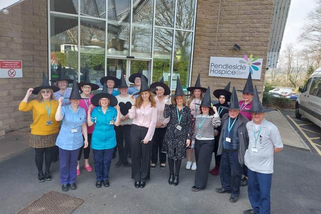 Samantha Giles joins in the ‘witches’ fun with staff at Pendleside Hospice