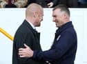 BURNLEY, ENGLAND - MARCH 29:   Manager of Leicester City Nigel Pearson (R) and Manager of Burnley Sean Dyche share a joke ahead of the Sky Bet Championship match between Burnley and Leicester City at Turf Moor on March 29, 2014 in Burnley, England.  (Photo by Jan Kruger/Getty Images)