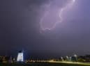 Lytham Windmill is lit up by a flash of lightning