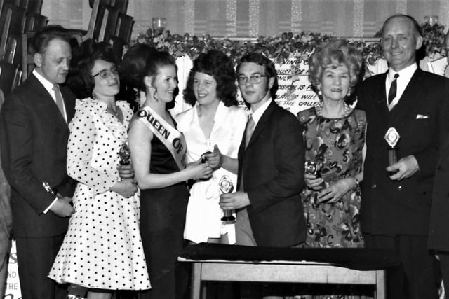 The finals of the Burnley Express Family Circle-Bass Charrington ballroom dancing competition proved so popular that there was a full house at Keighley Green Club on Friday, 28th May 1971. Weeks of exciting competition reached a climax for the 36 finalists in the modern sequence, modern quickstep and the free style events. Pictured with the Queen of Industry, Mrs Brenda Day, who made the presentation, are (from the left) Mr and Mrs Rowley, Miss Hart, Mr English and Mr and Mrs Sutcliffe.