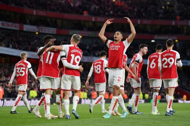 LONDON, ENGLAND - NOVEMBER 11: William Saliba of Arsenal celebrates with teammates after scoring the team's second goal during the Premier League match between Arsenal FC and Burnley FC at Emirates Stadium on November 11, 2023 in London, England. (Photo by Justin Setterfield/Getty Images)