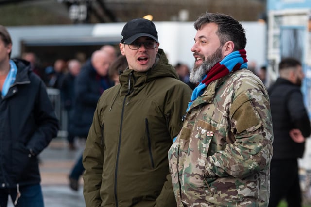 Burnley fans arrive at the Etihad Stadium ahead of their FA Cup Quarter Final fixture with Manchester City. Photo: Kelvin Stuttard