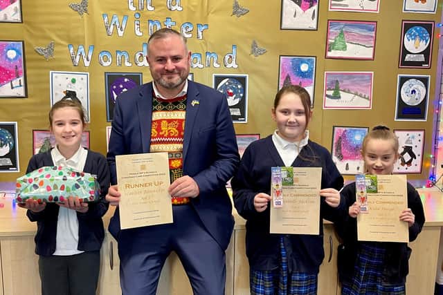 Pendle MP Andrew Stephenson with the winner and runners-up from his Christmas card competition