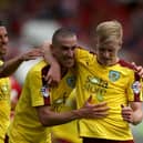 BRISTOL, ENGLAND - AUGUST 29:  Ben Mee of Burnley (r) celebrates scoring the opening goal with David Jones and George Boyd during the Sky Bet Championship match between Bristol City and Burnley at Ashton Gate on August 29, 2015 in Bristol, England.  (Photo by Martin Willetts/Getty Images)