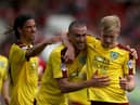 BRISTOL, ENGLAND - AUGUST 29:  Ben Mee of Burnley (r) celebrates scoring the opening goal with David Jones and George Boyd during the Sky Bet Championship match between Bristol City and Burnley at Ashton Gate on August 29, 2015 in Bristol, England.  (Photo by Martin Willetts/Getty Images)