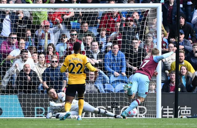 BURNLEY, ENGLAND - APRIL 24: Matej Vydra of Burnley scores their team's first goal past Jose Sa of Wolverhampton Wanderers during the Premier League match between Burnley and Wolverhampton Wanderers at Turf Moor on April 24, 2022 in Burnley, England. (Photo by Gareth Copley/Getty Images)
