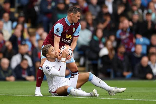 BURNLEY, ENGLAND - AUGUST 27: Connor Roberts of Burnley attempts to take the ball from Matty Cash of Aston Villa during the Premier League match between Burnley FC and Aston Villa at Turf Moor on August 27, 2023 in Burnley, England. (Photo by Lewis Storey/Getty Images)