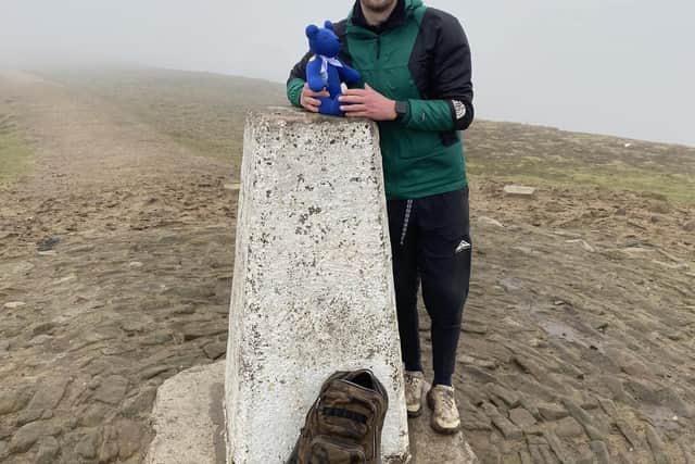 Connor Moffatt at the Pendle Hill trig point