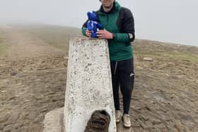 Connor Moffatt at the Pendle Hill trig point