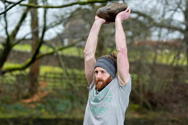 Bowland Fitness founder Matt Donnelly using a rock as a natural replacement for a kettle bell. Photo: Kelvin Stuttard