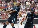 Stuttgart's defender Timo Baumgartl (C) vies for the ball with Manchester's defender Vincent Kompany (L) and Manchester's French defender Bacary Sagna during the friendly football match between VfB Stuttgart and Manchester City in Stuttgart, southern Germany, on August 1, 2015. AFP PHOTO / THOMAS KIENZLE        (Photo credit should read THOMAS KIENZLE/AFP via Getty Images)