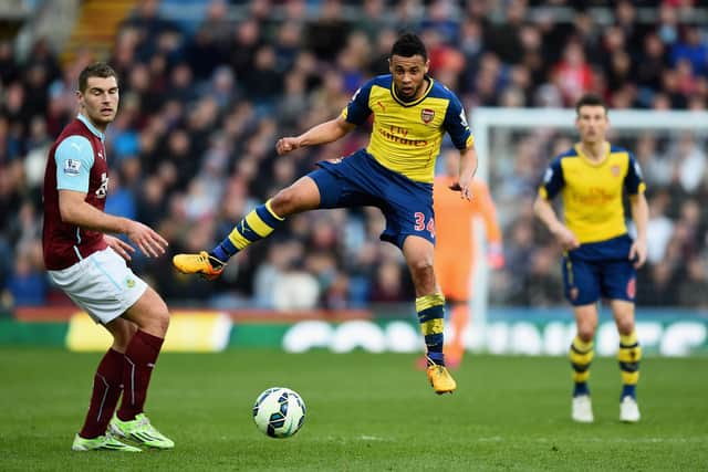 BURNLEY, ENGLAND - APRIL 11:  Francis Coquelin of Arsenal and Sam Vokes of Burnley compete for the ball during the Barclays Premier League match between Burnley and Arsenal at Turf Moor on April 11, 2015 in Burnley, England.  (Photo by Laurence Griffiths/Getty Images)