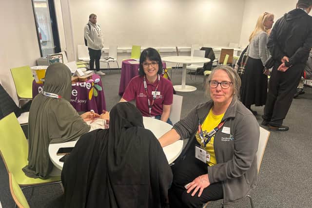 Pendleside Hospice staff getting their mehndi