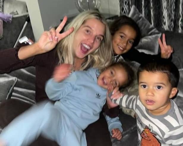 Helen Flangan with her three children in her lounge. Credit: hjgflanagan on Instagram