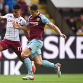 BURNLEY, ENGLAND - MAY 07: Ollie Watkins of Aston Villa battles for possession with James Tarkowski of Burnley during the Premier League match between Burnley and Aston Villa at Turf Moor on May 07, 2022 in Burnley, England. (Photo by Gareth Copley/Getty Images)