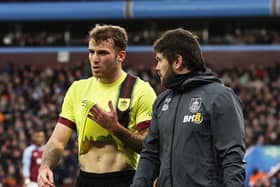 BIRMINGHAM, ENGLAND - DECEMBER 30: Jordan Beyer of Burnley leaves the field dejected after suffering an injury during the Premier League match between Aston Villa and Burnley FC at Villa Park on December 30, 2023 in Birmingham, England. (Photo by Ryan Pierse/Getty Images)