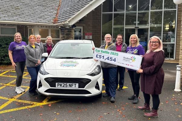 Cheque presentation showing how much has been raised.