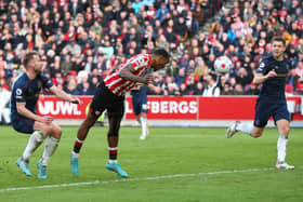 BRENTFORD, ENGLAND - MARCH 12: Ivan Toney of Brentford  scores their side's first goal during the Premier League match between Brentford and Burnley at Brentford Community Stadium on March 12, 2022 in Brentford, England.