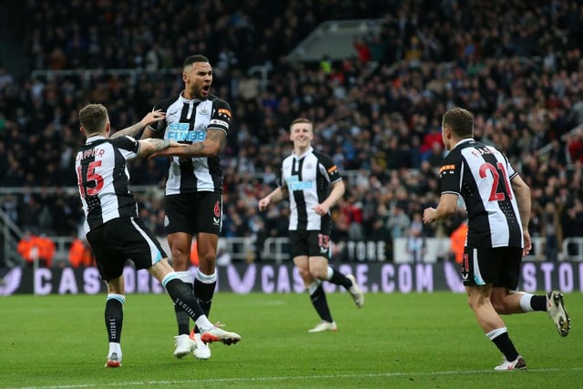 Jamaal Lascelles, Kieran Trippier and Ryan Fraser celebrate their side's first goal, an own goal by Mason Holgate of Everton (not pictured) during the Premier League match between Newcastle United and Everton at St. James Park on February 08, 2022 in Newcastle upon Tyne, England. (Photo by Alex Livesey/Getty Images)